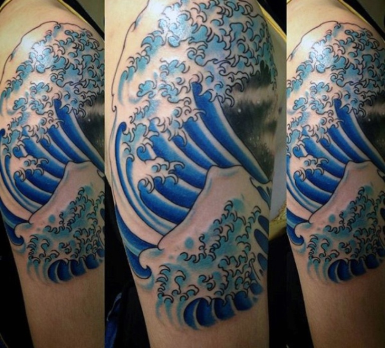 Dolphin through tribal waves tattoo