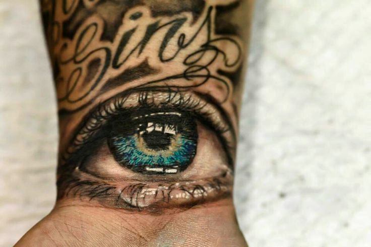 Realistic Blue Eye on Wrist Tattoo by Izzy Garcia