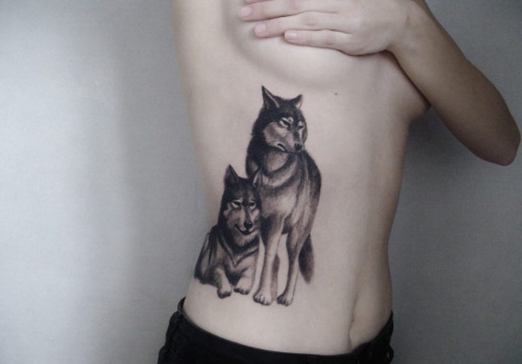 rib tattoos wolf