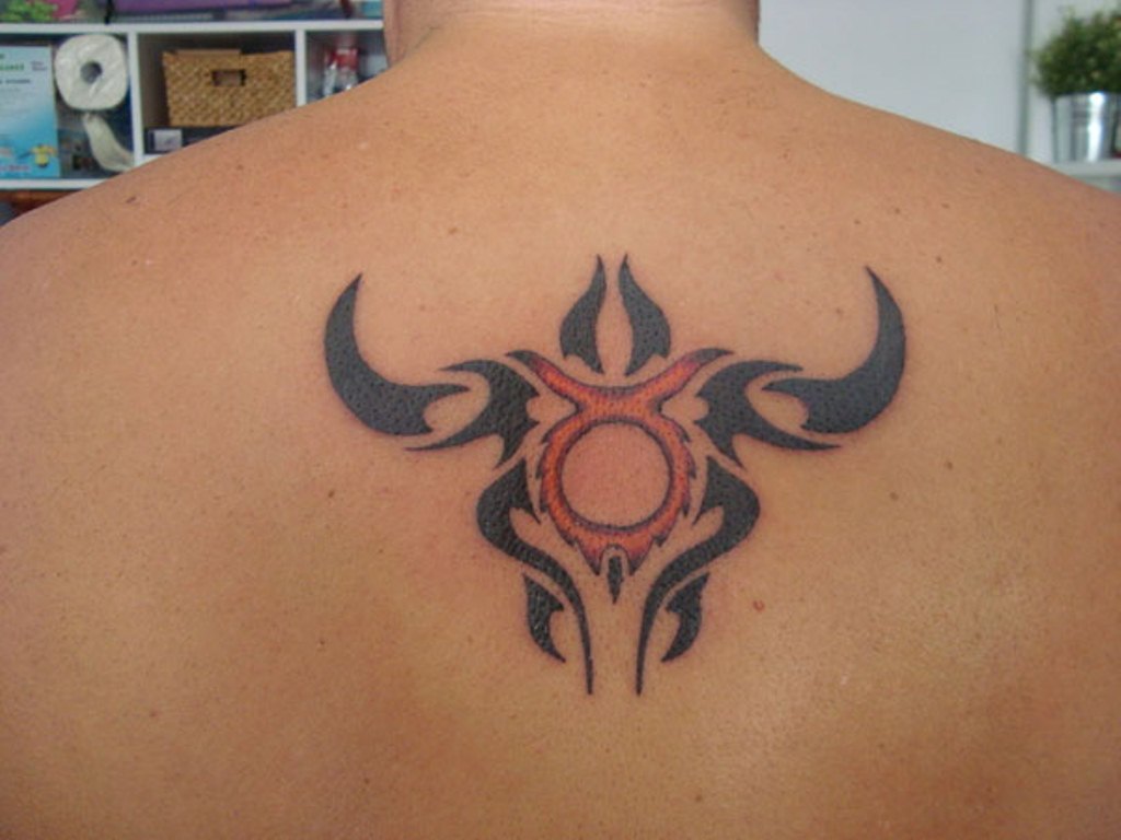 Minimalistic style bull skull tattoo located on the